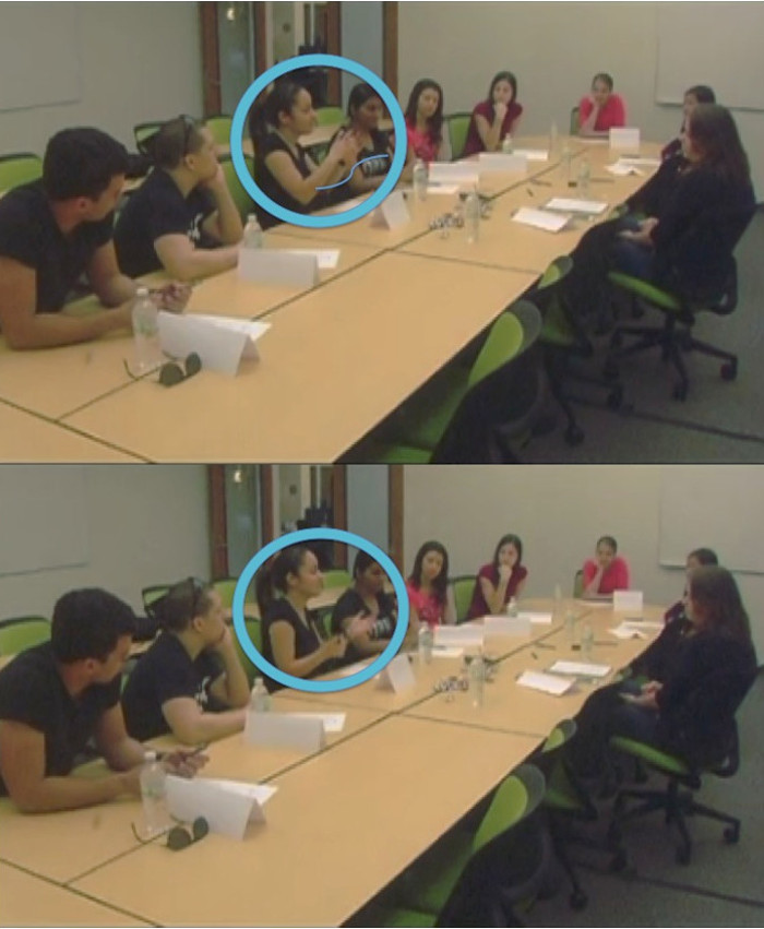 Two pictures of 9 students and one researcher sitting around the table. One student’s image is circled in each picture. In the top picture, a wave signals how that student is moving her hands.