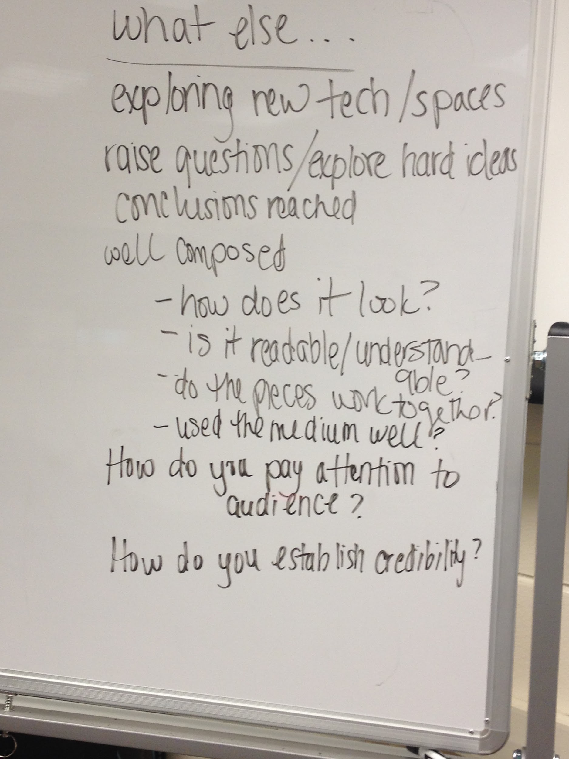 A photograph of a whiteboard with notes and questions about how to evaluate the technical communication project.